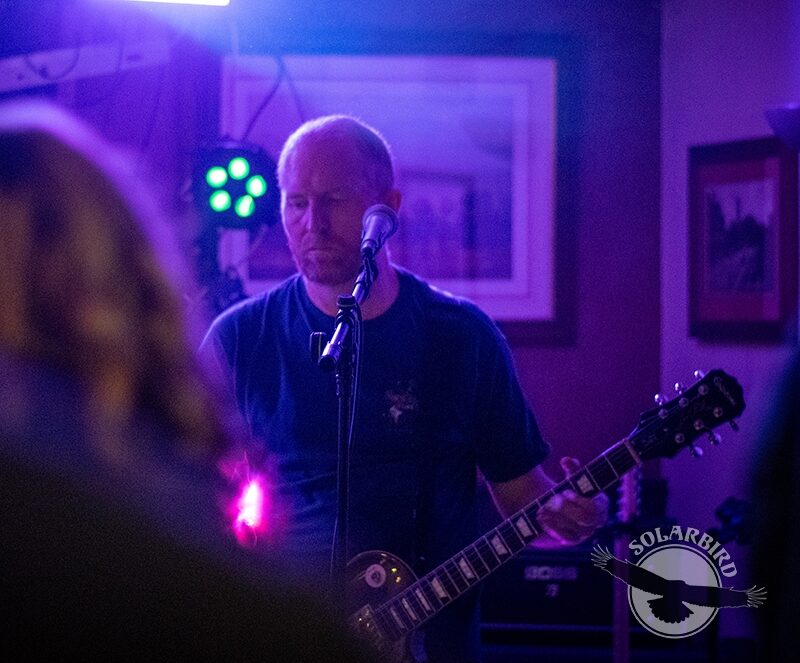 Rob playing guitar in Solarbird